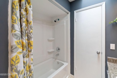Welcome to maintenance-free living in the heart of Pelican Bay on The Club At Pelican Bay - North Course in Florida - for sale on GolfHomes.com, golf home, golf lot