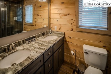 This charming Creekside cabin offers the perfect blend of on Beech Mountain Club in North Carolina - for sale on GolfHomes.com, golf home, golf lot