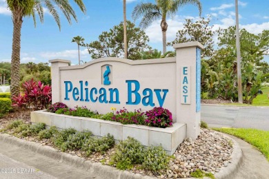 Welcome to maintenance-free living in the heart of Pelican Bay on The Club At Pelican Bay - North Course in Florida - for sale on GolfHomes.com, golf home, golf lot
