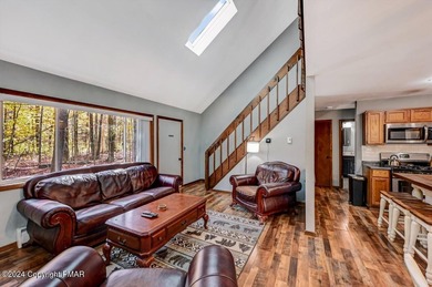 This Timber Trails three-generation family home in Lake Naomi on Lake Naomi Timber Trails Golf Club in Pennsylvania - for sale on GolfHomes.com, golf home, golf lot