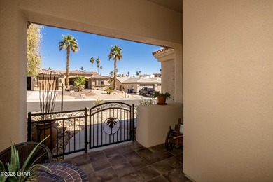 Take a look at this stunning RV garage home located in a private on London Bridge Golf Course in Arizona - for sale on GolfHomes.com, golf home, golf lot