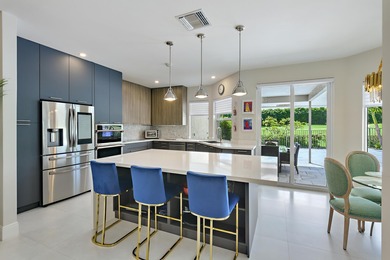 This elegantly remodeled contemporary pool home is located in on Boca Grove Golf and Tennis in Florida - for sale on GolfHomes.com, golf home, golf lot