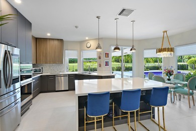 This elegantly remodeled contemporary pool home is located in on Boca Grove Golf and Tennis in Florida - for sale on GolfHomes.com, golf home, golf lot