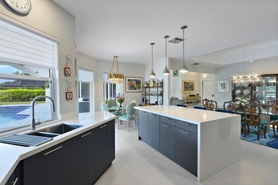 This elegantly remodeled contemporary pool home is located in on Boca Grove Golf and Tennis in Florida - for sale on GolfHomes.com, golf home, golf lot