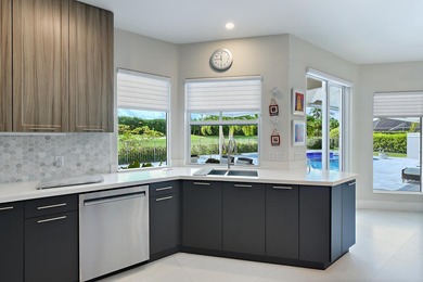 This elegantly remodeled contemporary pool home is located in on Boca Grove Golf and Tennis in Florida - for sale on GolfHomes.com, golf home, golf lot