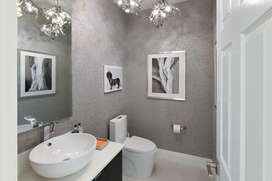 This elegantly remodeled contemporary pool home is located in on Boca Grove Golf and Tennis in Florida - for sale on GolfHomes.com, golf home, golf lot