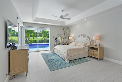 This elegantly remodeled contemporary pool home is located in on Boca Grove Golf and Tennis in Florida - for sale on GolfHomes.com, golf home, golf lot