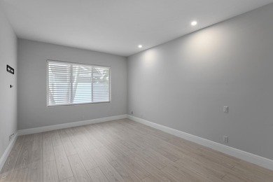 This elegantly remodeled contemporary pool home is located in on Boca Grove Golf and Tennis in Florida - for sale on GolfHomes.com, golf home, golf lot