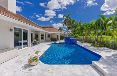 This elegantly remodeled contemporary pool home is located in on Boca Grove Golf and Tennis in Florida - for sale on GolfHomes.com, golf home, golf lot