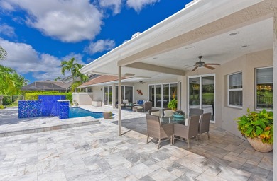 This elegantly remodeled contemporary pool home is located in on Boca Grove Golf and Tennis in Florida - for sale on GolfHomes.com, golf home, golf lot