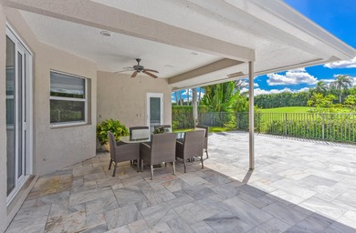 This elegantly remodeled contemporary pool home is located in on Boca Grove Golf and Tennis in Florida - for sale on GolfHomes.com, golf home, golf lot