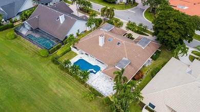 This elegantly remodeled contemporary pool home is located in on Boca Grove Golf and Tennis in Florida - for sale on GolfHomes.com, golf home, golf lot