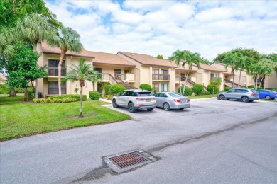 Light and bright second floor unit overlooking the golf course on Boca Delray Golf and Country Club in Florida - for sale on GolfHomes.com, golf home, golf lot