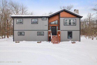 It's turnkey and ready for you to move in! Spacious, fully on Pocono Farms Country Club in Pennsylvania - for sale on GolfHomes.com, golf home, golf lot