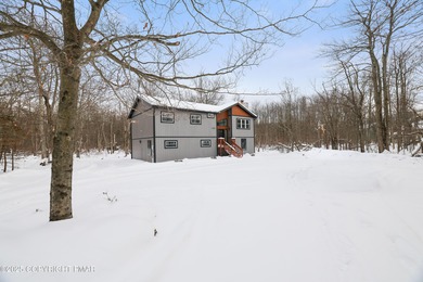It's turnkey and ready for you to move in! Spacious, fully on Pocono Farms Country Club in Pennsylvania - for sale on GolfHomes.com, golf home, golf lot
