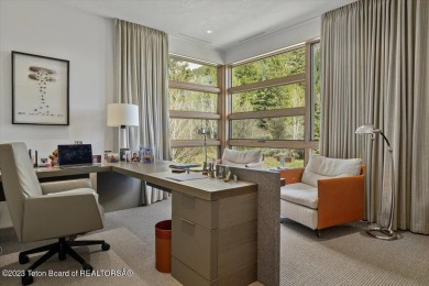 Offered fully turnkey, this stunning mountain contemporary home on Snake River Sporting Club in Wyoming - for sale on GolfHomes.com, golf home, golf lot