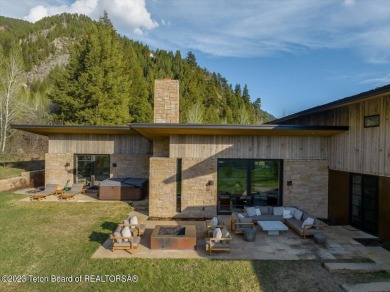 Offered fully turnkey, this stunning mountain contemporary home on Snake River Sporting Club in Wyoming - for sale on GolfHomes.com, golf home, golf lot