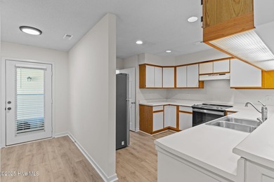 Welcome home 6128 Inland Greens Drive in nestled in the amenity on Inland Greens Golf Course in North Carolina - for sale on GolfHomes.com, golf home, golf lot