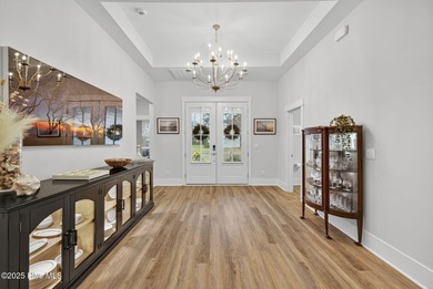 Move-in ready and meticulously maintained, this beautiful home on Cape Fear National At Brunswick Forest in North Carolina - for sale on GolfHomes.com, golf home, golf lot