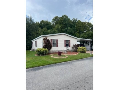 Welcome to your adorable getaway home in The Hamptons Golf and on Hamptons Golf Club in Florida - for sale on GolfHomes.com, golf home, golf lot