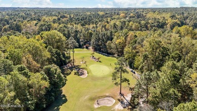 This golf front oasis is located on the picturesque 12th hole of on Seven Lakes Country Club in North Carolina - for sale on GolfHomes.com, golf home, golf lot