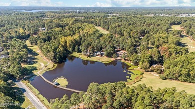 This golf front oasis is located on the picturesque 12th hole of on Seven Lakes Country Club in North Carolina - for sale on GolfHomes.com, golf home, golf lot