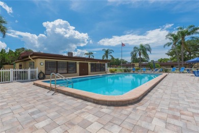Ready to swap high-maintenance for high-enjoyment? This on The Dunedin Country Club in Florida - for sale on GolfHomes.com, golf home, golf lot