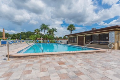 Ready to swap high-maintenance for high-enjoyment? This on The Dunedin Country Club in Florida - for sale on GolfHomes.com, golf home, golf lot