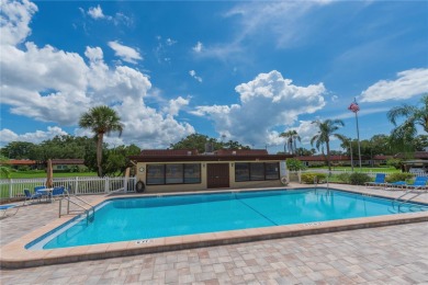 Ready to swap high-maintenance for high-enjoyment? This on The Dunedin Country Club in Florida - for sale on GolfHomes.com, golf home, golf lot
