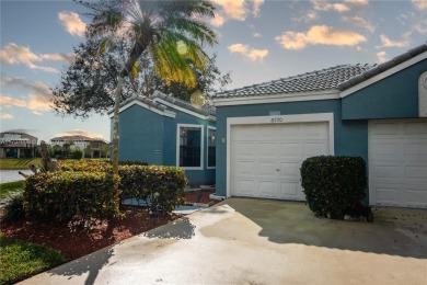 This charming two-bedroom, two-bathroom townhouse offers a on Woodmont Country Club in Florida - for sale on GolfHomes.com, golf home, golf lot