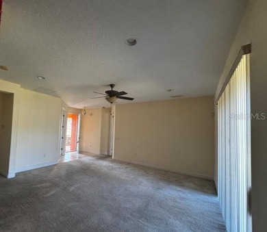 Delightful 2 bedroom, 2 bath home with a versatile den/office on Stonegate Golf Club in Florida - for sale on GolfHomes.com, golf home, golf lot