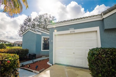 This charming two-bedroom, two-bathroom townhouse offers a on Woodmont Country Club in Florida - for sale on GolfHomes.com, golf home, golf lot