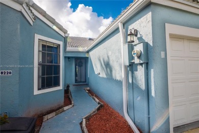 This charming two-bedroom, two-bathroom townhouse offers a on Woodmont Country Club in Florida - for sale on GolfHomes.com, golf home, golf lot