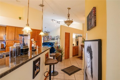 This charming two-bedroom, two-bathroom townhouse offers a on Woodmont Country Club in Florida - for sale on GolfHomes.com, golf home, golf lot