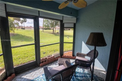 This charming two-bedroom, two-bathroom townhouse offers a on Woodmont Country Club in Florida - for sale on GolfHomes.com, golf home, golf lot