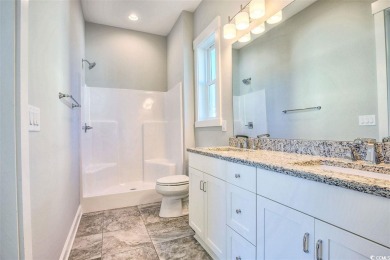 The Georgetown sits on Lot 49 in Living Dunes, a Grande Dunes on The Dunes Golf and Beach Club in South Carolina - for sale on GolfHomes.com, golf home, golf lot