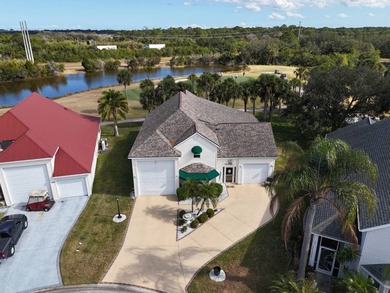 Beautiful lake and golf course views from this custom model home on The Great Outdoors Golf and Country Club in Florida - for sale on GolfHomes.com, golf home, golf lot