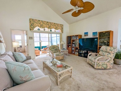 Beautiful lake and golf course views from this custom model home on The Great Outdoors Golf and Country Club in Florida - for sale on GolfHomes.com, golf home, golf lot