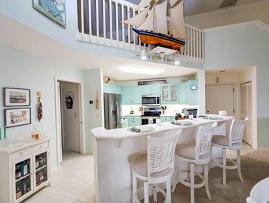 Beautiful lake and golf course views from this custom model home on The Great Outdoors Golf and Country Club in Florida - for sale on GolfHomes.com, golf home, golf lot