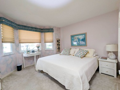 Beautiful lake and golf course views from this custom model home on The Great Outdoors Golf and Country Club in Florida - for sale on GolfHomes.com, golf home, golf lot