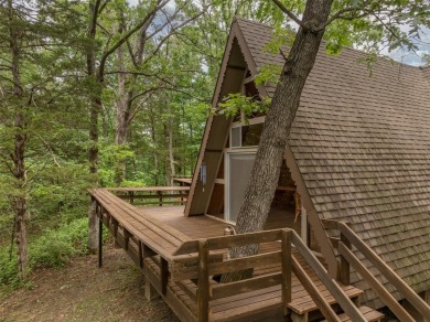 Welcome to your perfect weekend escape. This cozy chalet sits on on Innsbrook Resort Golf Course in Missouri - for sale on GolfHomes.com, golf home, golf lot