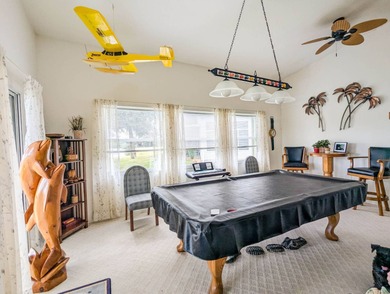 Beautiful lake and golf course views from this custom model home on The Great Outdoors Golf and Country Club in Florida - for sale on GolfHomes.com, golf home, golf lot