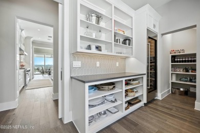 A custom home with panoramic Intracoastal views behind the gates on Queens Harbour Yacht and Country Club in Florida - for sale on GolfHomes.com, golf home, golf lot