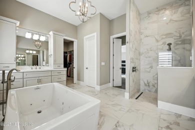 A custom home with panoramic Intracoastal views behind the gates on Queens Harbour Yacht and Country Club in Florida - for sale on GolfHomes.com, golf home, golf lot