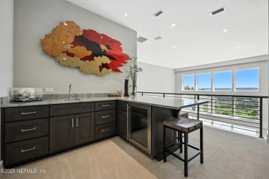 A custom home with panoramic Intracoastal views behind the gates on Queens Harbour Yacht and Country Club in Florida - for sale on GolfHomes.com, golf home, golf lot