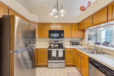 Ground floor condo in the highly desirable East Lake Woodlands on East Lake Woodlands Country Club in Florida - for sale on GolfHomes.com, golf home, golf lot