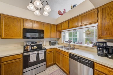 Ground floor condo in the highly desirable East Lake Woodlands on East Lake Woodlands Country Club in Florida - for sale on GolfHomes.com, golf home, golf lot