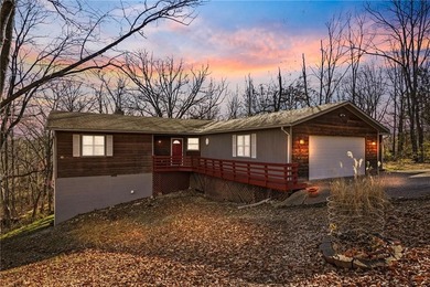 Enjoy a lake view setting paired with a flexible floor plan full on Bella Vista Country Club - Scottsdale in Arkansas - for sale on GolfHomes.com, golf home, golf lot