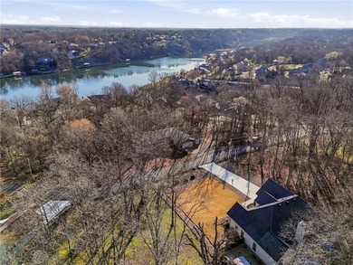 Enjoy a lake view setting paired with a flexible floor plan full on Bella Vista Country Club - Scottsdale in Arkansas - for sale on GolfHomes.com, golf home, golf lot