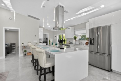 This stunning 3-bedroom, 2-bath waterfront home has it on Boca Raton Municipal Golf Course in Florida - for sale on GolfHomes.com, golf home, golf lot